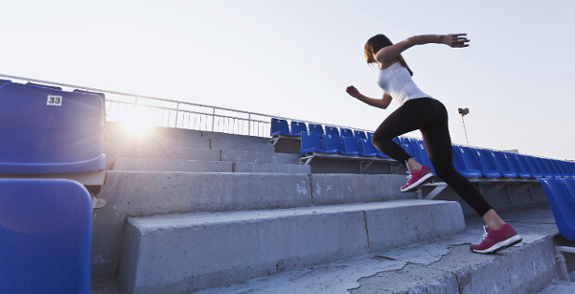 sportswoman running upstairs